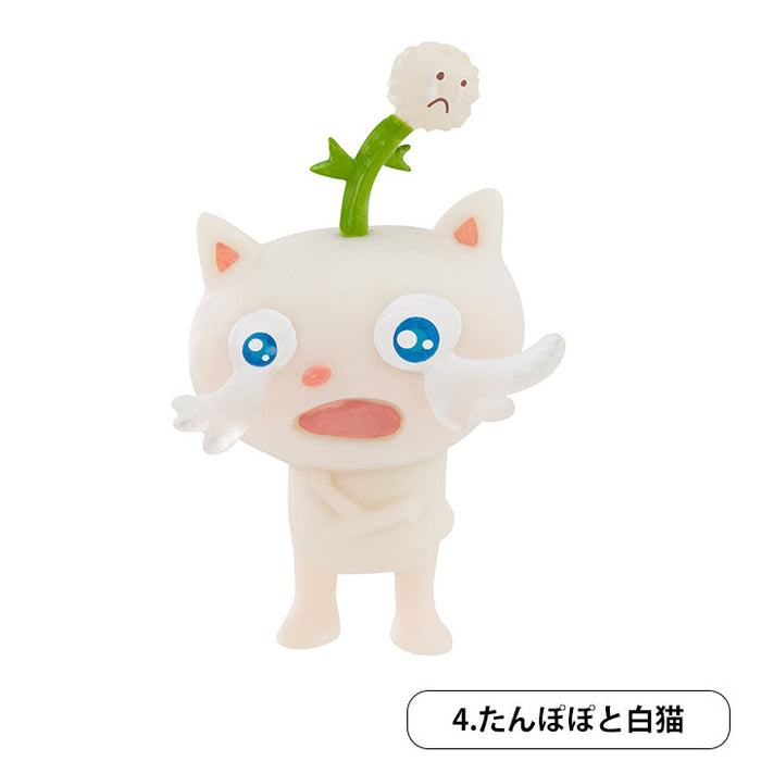 たんぽぽと白猫